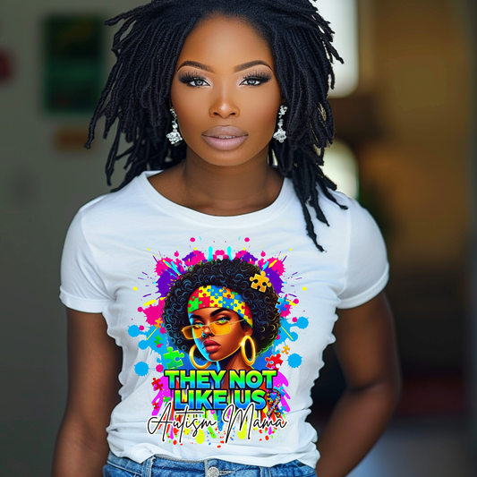 Vibrant Autism Mama t-shirt with afrocentric design, splash effect, and the statement 'They Not Like Us.' Perfect for autism awareness and advocacy.